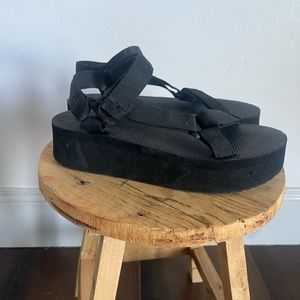 Black flat form sandals